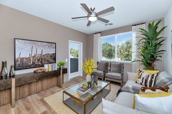 A living room with a couch and a ceiling fan